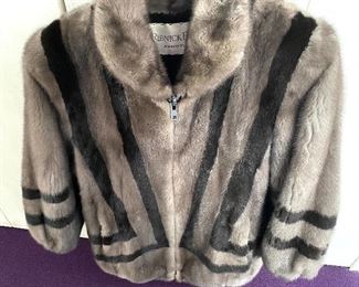 Ladies Fur Coat w/ Unique Design - Quality crafted coat from Ribnick Furs. Comes with a pair of earmuffs.  This jacket has two front pockets and a quality interior lining that is stitched inside with the previous owner's name. No size label, however; likely a size small.  