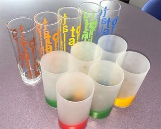 Super fun bar glasses! Five 7" tumblers that have rainbow colored graphics that say, "Tall Drink" and six frosted tumblers with rainbow colored bottoms measuring 5.25" tall 