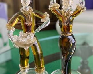 What a fun pair of hand crafted art glass figurines. Likely Venetian art glass?  No noticed chips or cracks. The female figurine measures 13" and the male figurine at 12" tall 