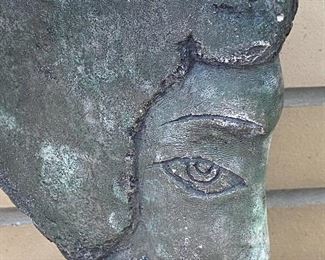 Face; Figural Sculpture - possibly made of stone?  One small chip on the top. Measures 13" H and the base is 8" x 3" 