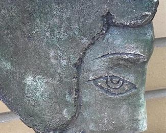 Face; Figural Sculpture - possibly made of stone?  One small chip on the top. Measures 13" H and the base is 8" x 3" 