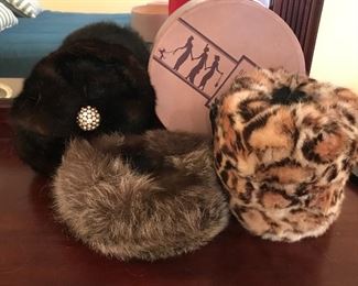 Assorted fur hats and muff