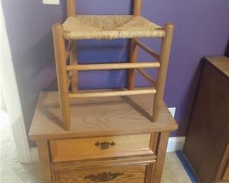 Ladderback chair and bedside dresser.