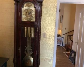 #4	Howard Miller Grandfather Clock w/weights and pendilum  (21x15x91)  (Hand-carving)	 $400.00 
