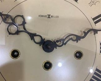 #23	Howard Miller Wall Clock w/key (front open) inlaid around clock face  25.5x16.5x5   Model  612-210	 $125.00 
