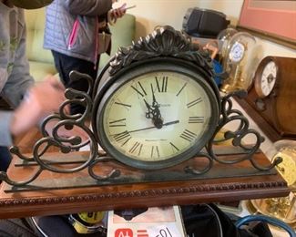 #69	Howard Miller - Battery Operated Mantle Clock w/Iron/Wood w/windsor Chime	 $30.00 

