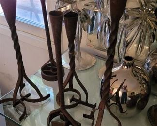 Wrouhht iron candle sticks fashioned from branding irons