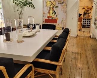 Huge custom dining table ...10 rattan arm chairs...both sold separately.