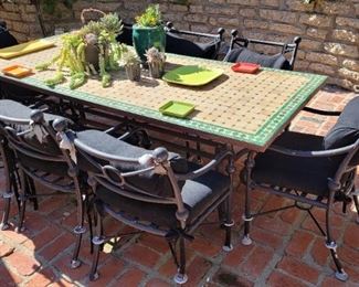 Cast iron tile top patio table and 8 chairs