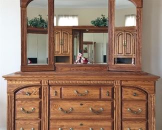 Georgian Court dresser with mirror 78.5" high, 70" wide, 19.75" deep. Mirror doors open to jewelry storage on one side, shelves on other side. 