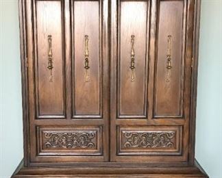 Armoire/chest of drawers Arched top, double doors open to 4 drawers and shelf storage, two large lower drawers. 74.5" high, 39" wide, 19.5" deep. 