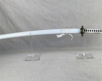 Mfg - 41" Samurai sword
Model - (White)
Located in Chattanooga, TN
This lot contains a replica 41" samurai sword with a white saya and Ito. Blade has a length of 27.5" with a replicated hamon line. Blade is not sharp, it is a replica.