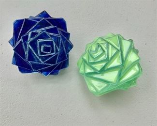 $50 - Pair, green and blue glass floral decorative table decor or paperweights; 1 3/4 in. (H) x 3 in. (W)
