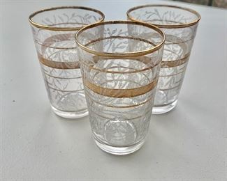 $15 - Three Moroccan gold rimmed and decorated tea glasses with surface appliqué; 3 1/2 in. (H)
