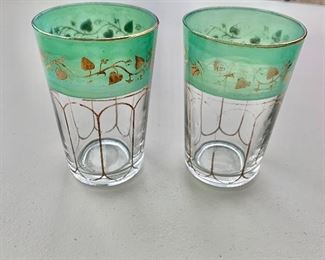 $4 - Two vintage Moroccan tea glasses with green and gold decoration with vines; 3 1/2 in. (H) AS IS 