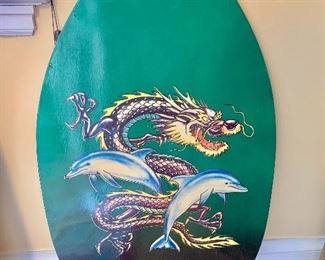 $40 - Modern wooden skim board dragon and dolphin designed and glazed; 35 in. (H) x 20 in. (W)