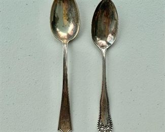 $30 - Pair of sterling spoons, each with engraving on handles.
