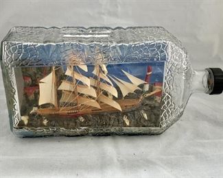 $100 - Vintage ship "Canada" in a bottle; note ship is flying the Canadian flag - 10 in. (L)  x 5 in. (W)
