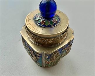 $20 - Brass jar with enamel decorations and blue finial; 4 in. (H) x 2 1/2 in. (W)