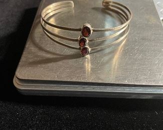 Garnet cuff bracelet - two and half inches at its widest can expand - price 30 dollars 