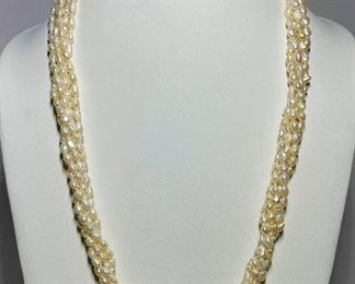 Long pearl necklace with rare three color jadeite carving - around 28 inches in length - price 1000 dollars