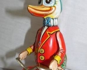 WIND UP DUCK ON TRICYCLE TOY 