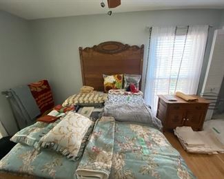 Full-size antique head and footboard, various size bedding including sheets blankets pillows.