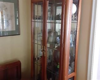 Glass lighted curio cabinet $100