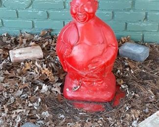 Red cement Buddha Red cement Buddha