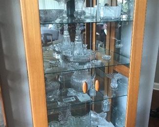 Fostoria glassware. We have 2 Solid Teak Display cases, glass shelves, mirrored back, lighted! 
Have extra shelves & mounts for above cases. 