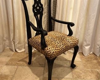 A reimagined antique claw foot side chair with arms