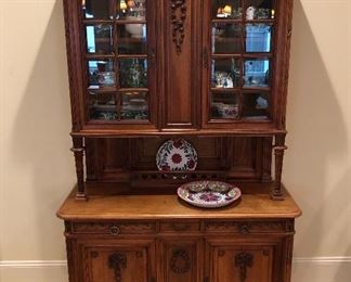 19th century French Buffet du Corps featuring hand carved details. Separates into two pieces for versatility 