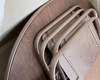 Round folding table and 4 chairs. In good condition