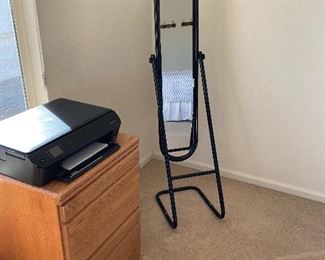 Thin floor length mirror. Black frame. 2 drawer wooed file cabinet.