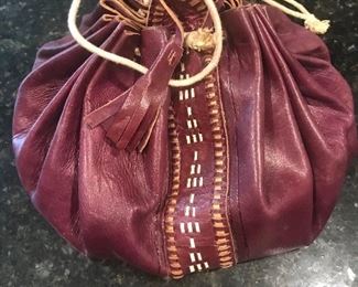 Leather bag with over 220 marbles 