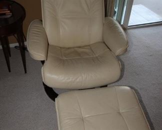 $895. Hjellegjerde Stressless recliner and foot stool. Cream leather.