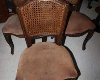 $200 set of 4. Four cane back dining chairs with faux suede seats.