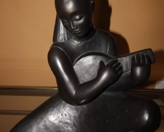 $150. Austin Productions sculpture of woman with mandolin.