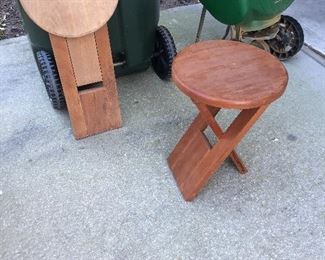 2 Very cool teak  folding stools  $30 for
Both
