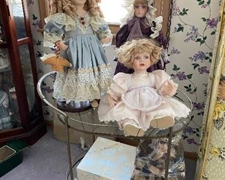 Dolls, brass and glass tea cart