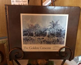 The Golden Crescent. 1st Edition.  Signed by Cowan and Brister.  A collection of stories by Bob Brister, paintings by Jack (John) Cowan. Hand bound and fall for brown leather with 30 for color plates, tissue card signed by Cowan and Brister. 