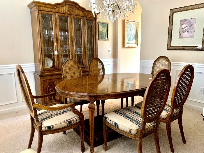 Heritage dining table includes 2 leaves and 8 cane backed chairs. 

*there is also a matching china cabinet and sideboard*