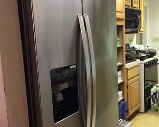 Whirlpool, stainless, side by side refrigerator. Beautiful.
