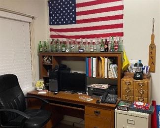 Computer desk, Dell computer, office chair, 2 drawer filing cabinet, card catalog, vintage drink bottle collection,  and American Flag
