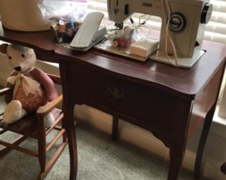 Vintage sewing machine in cabinet