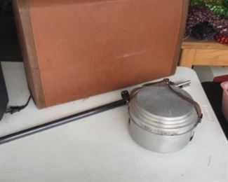 Vintage suitcase, gun barrel, camping dishes
