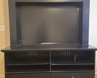 Media center in black comes in two separate pieces. Top piece has a total of nine shelves. Three across top and three on each side. Bottom piece has two drawers. Media center when put together measures 60" x 20" x 73".

https://ctbids.com/#!/description/share/768216