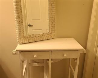 Cart and mirror both white. Mirror is framed in white painted wicker. Mirror measures 20" x 3" x 31". Rolling cart does have wheels that lock so it won't move when you need it to stay in one place. Has a extension for one side. Cart measures 31" x 30" (with extension) 15" (without extension) x 33". Tried many times to open drawers but could not get them open.

https://ctbids.com/#!/description/share/768215