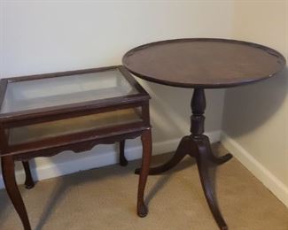 Brandt three leg tea table made of genuine mahogany is 26" circumference x 27" tall. Shadowbox table measures 22" x 17" x 24". Legs are slightly wobbly though has twist knobs to tighten them.

https://ctbids.com/#!/description/share/768219