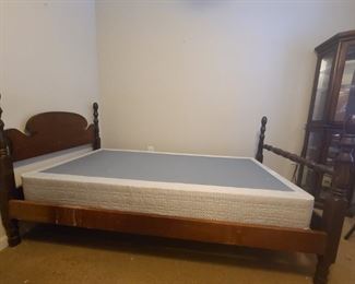 Wooden bed frame does come with box spring but no mattress. Measures 80" x 41" x 43". No screws or metal, sides just slide into slits boards lay across sides to make base for boxspring and or mattress.

https://ctbids.com/#!/description/share/768228